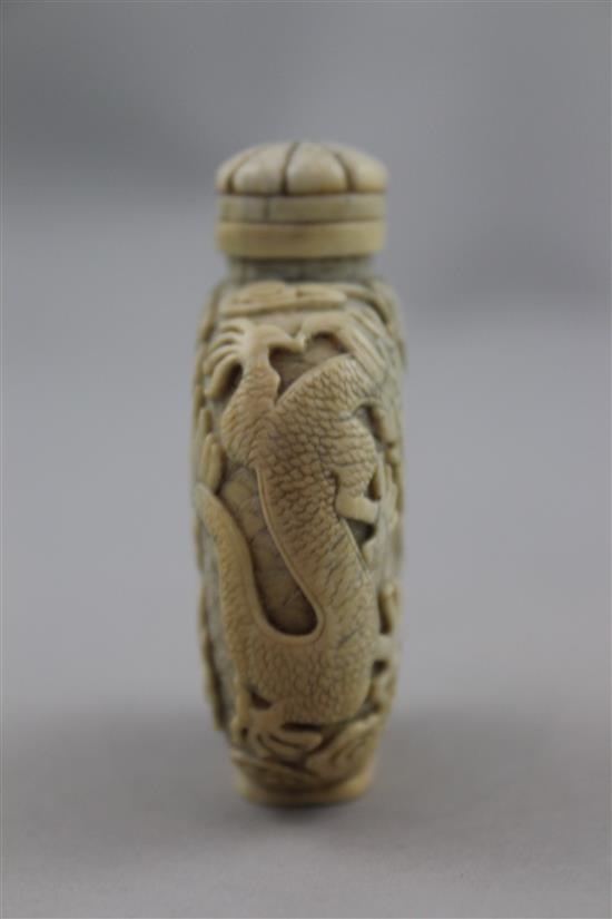 A Chinese ivory dragon and luohan snuff bottle, 1800-1850, 6.2cm